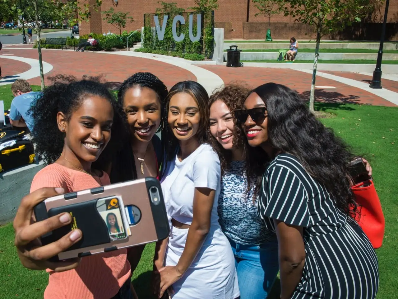 Students taking a group selfie.