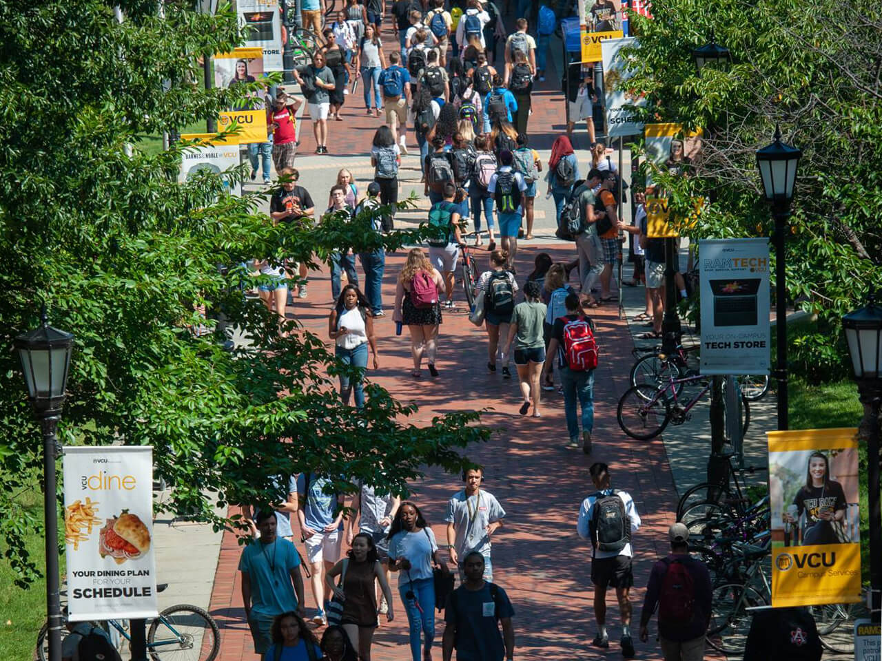 Students walking to class through the commons courtyard