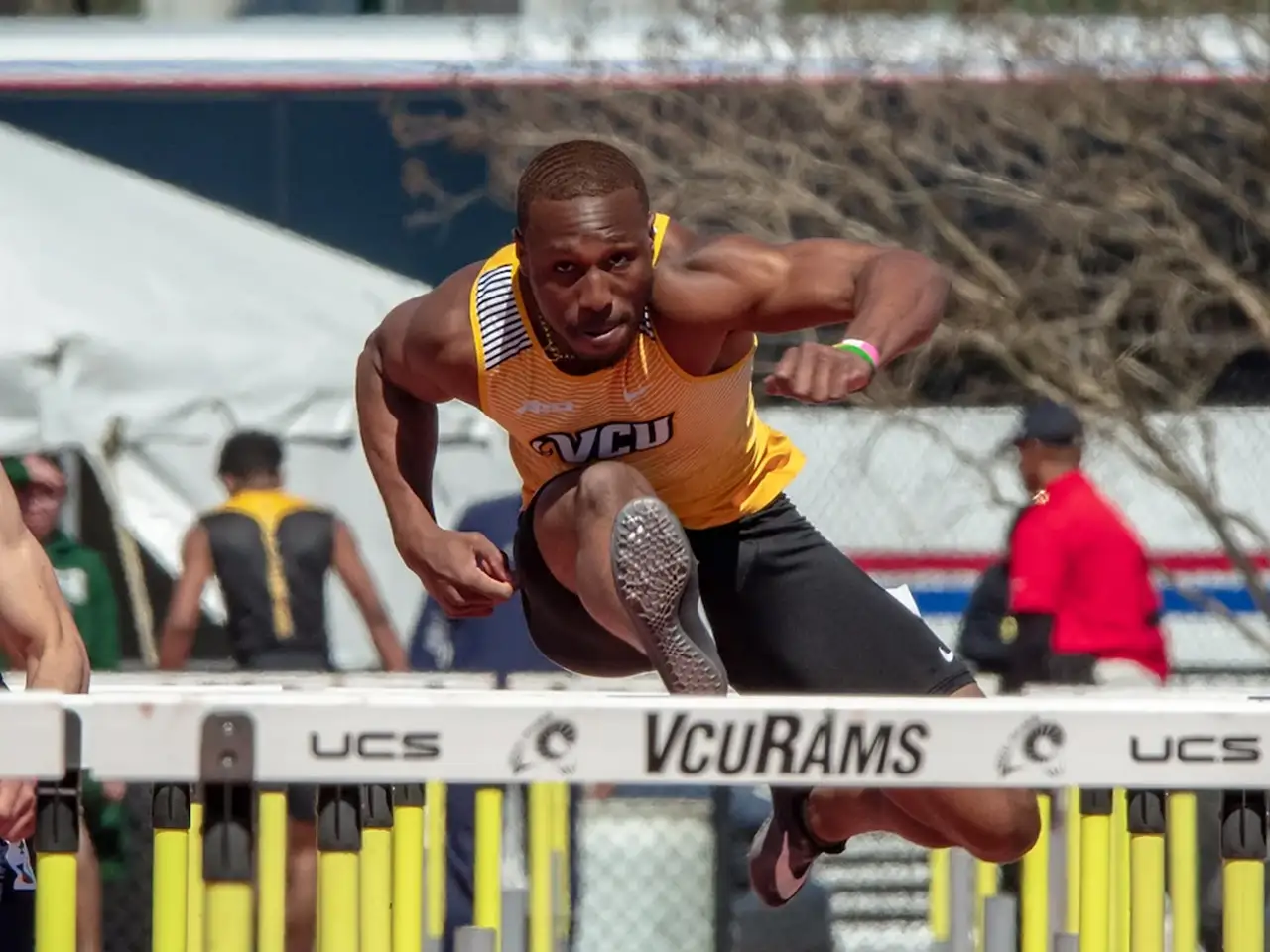 Student athlete competing in hurdles event.