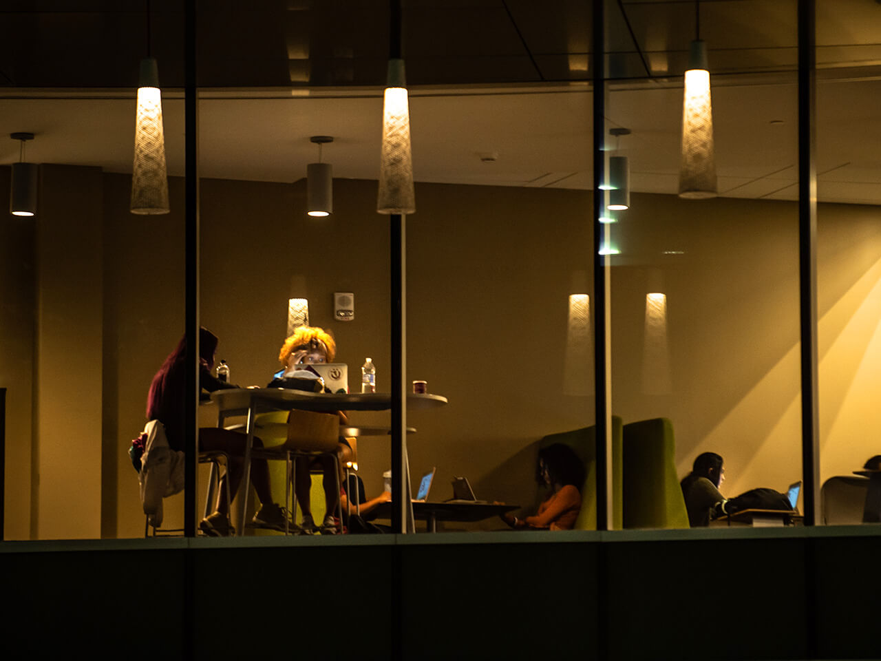 Students studying at night in the library