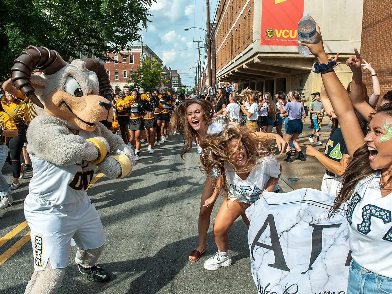 Students celebrating with Rodney the ram.