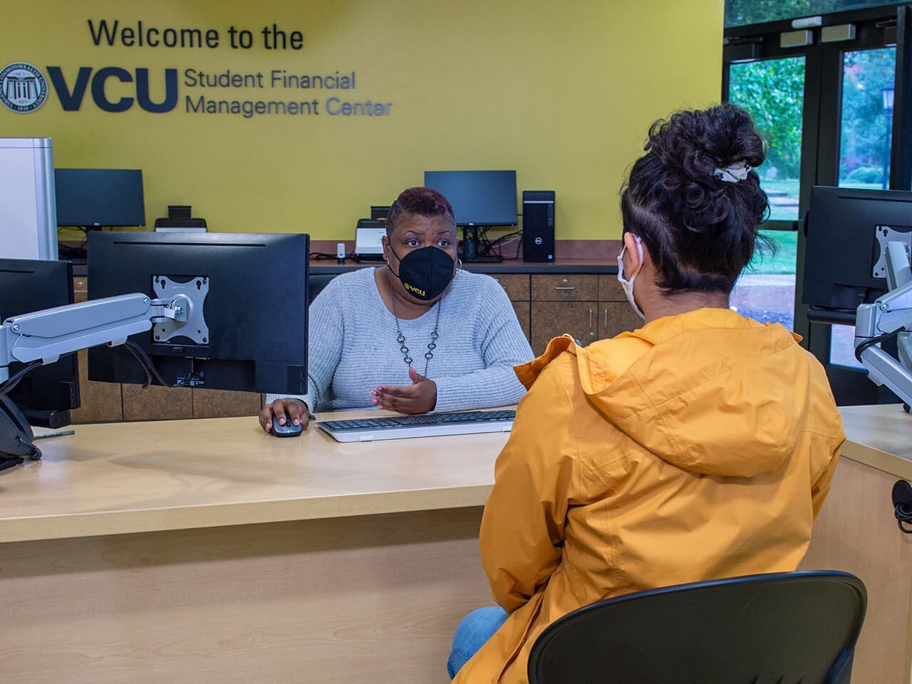 Student financial counselor meeting with a student