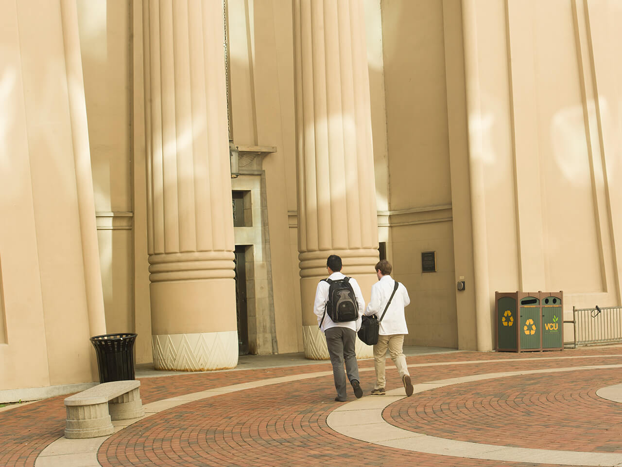 Students walking in front of the Egyptian Building