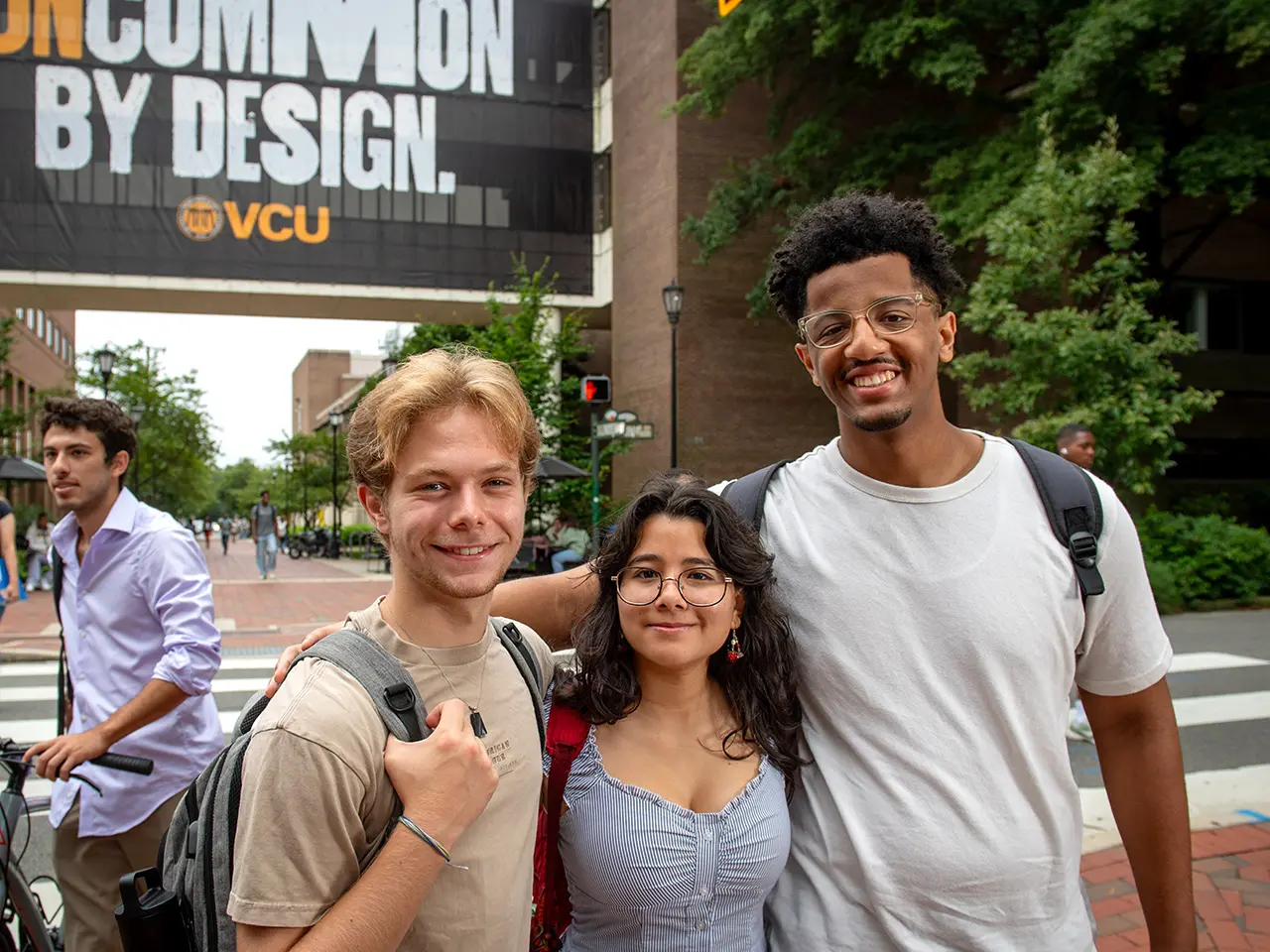 Students grouped together smiling on the first day of classes