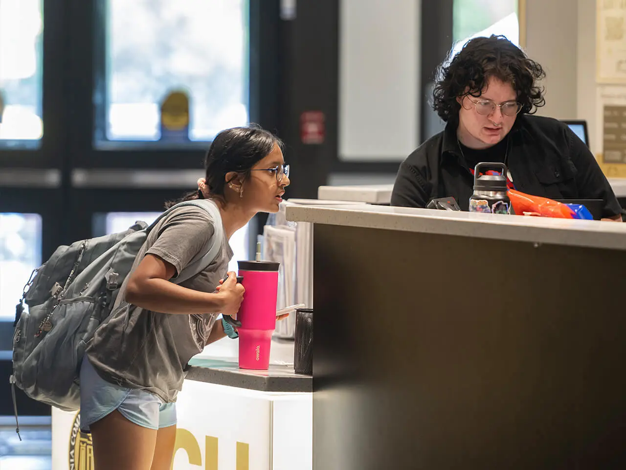 student asking question at help desk