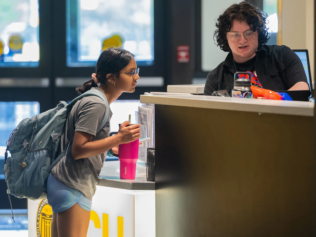 student asking question at help desk